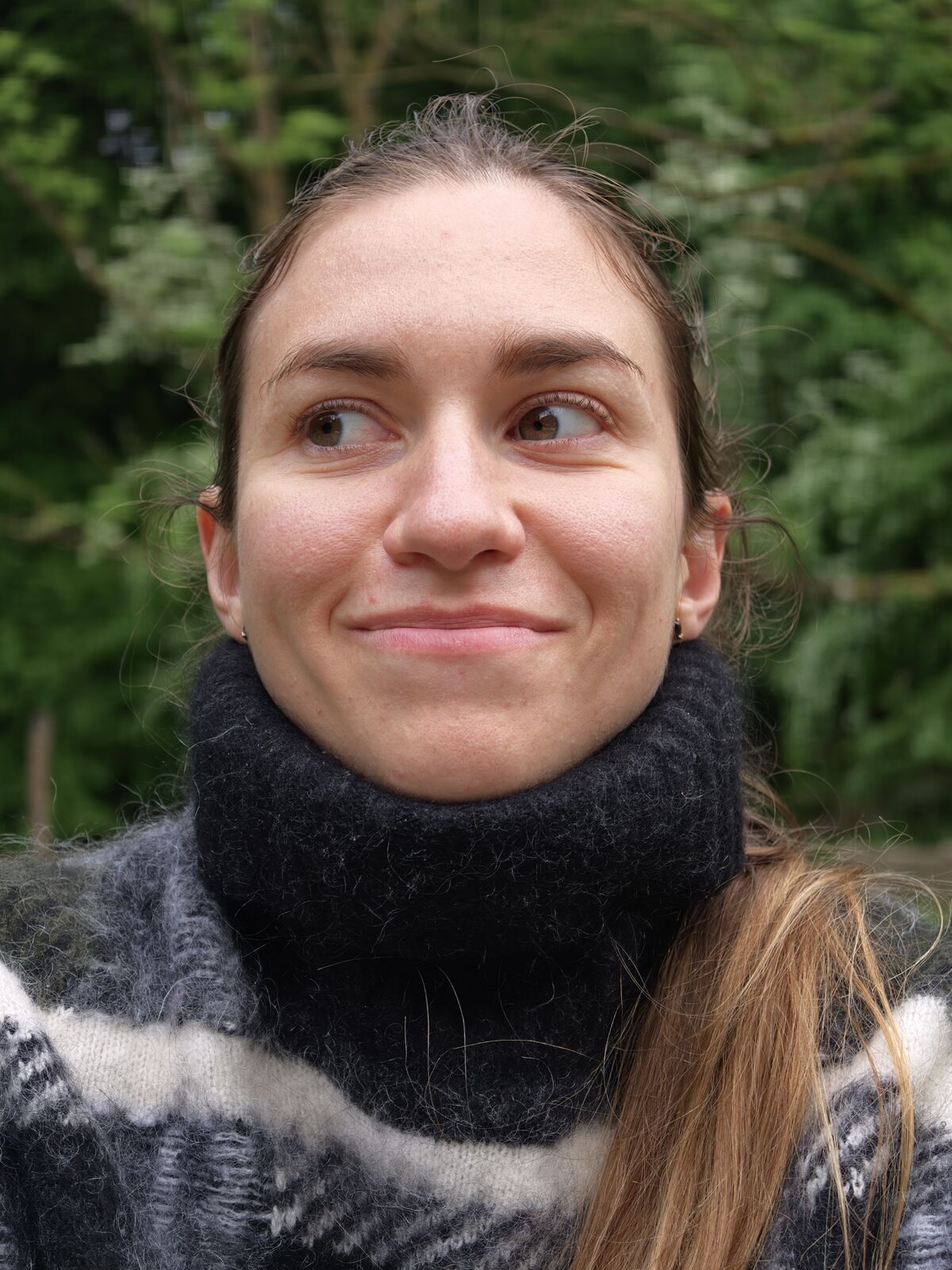 Olga smiling and looking to the side